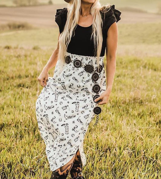 The cowprint skirt+black top