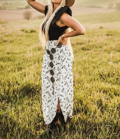 The cowprint skirt+black top