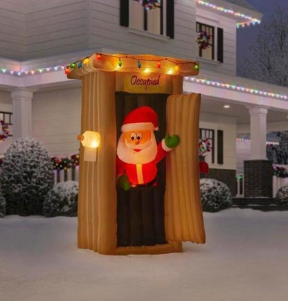 Christmas-animated inflatable santa coming out of the house