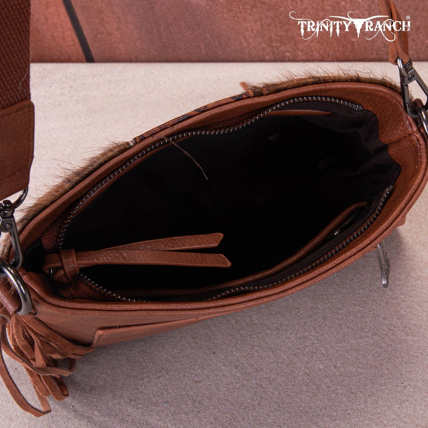 TR159G-9360   Trinity Ranch Hair-On Cowhide/Tooled Fringe Concealed Carry Crossbody Bag