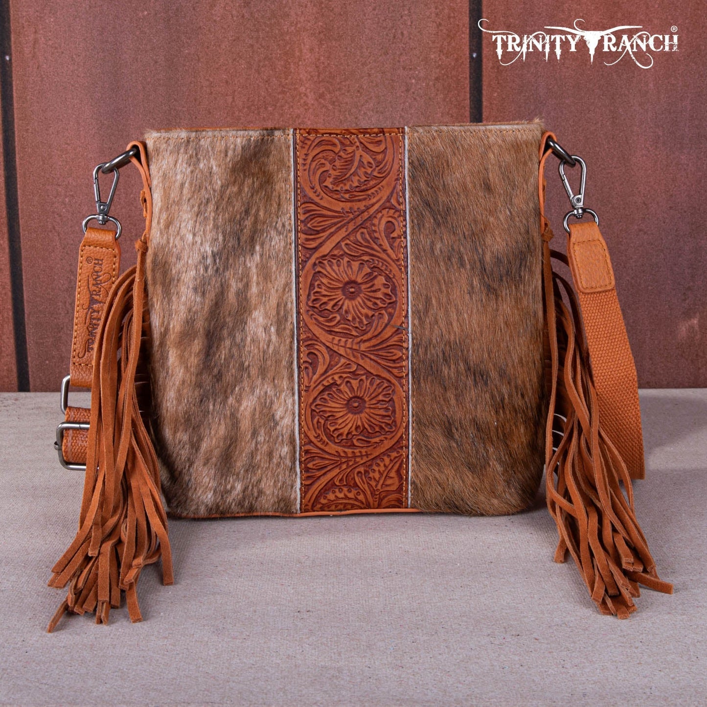 TR159G-9360   Trinity Ranch Hair-On Cowhide/Tooled Fringe Concealed Carry Crossbody Bag