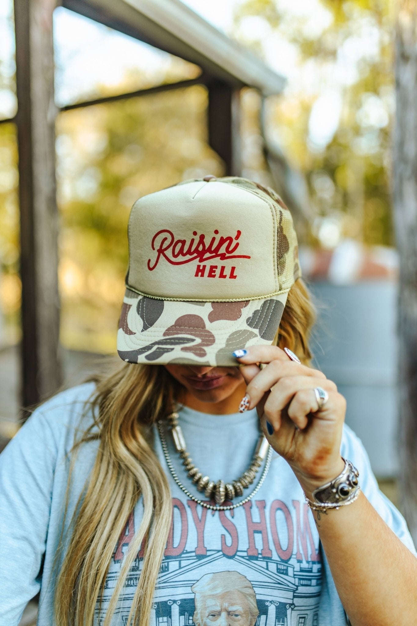 Raisin' Hell Green Camo Trucker Hat